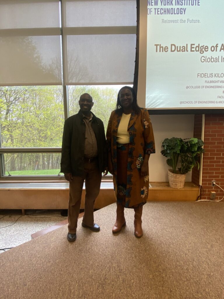 two academics standing together on a stage